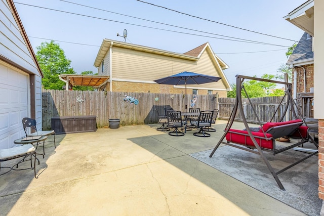 7733 Suburban Ln, Bridgeview, IL 60455 - fenced backyard with a patio area and outdoor dining area