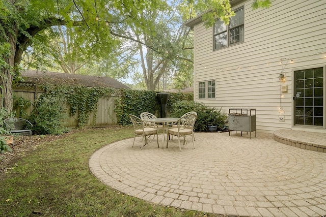 view of patio featuring a fenced backyard and outdoor dining area