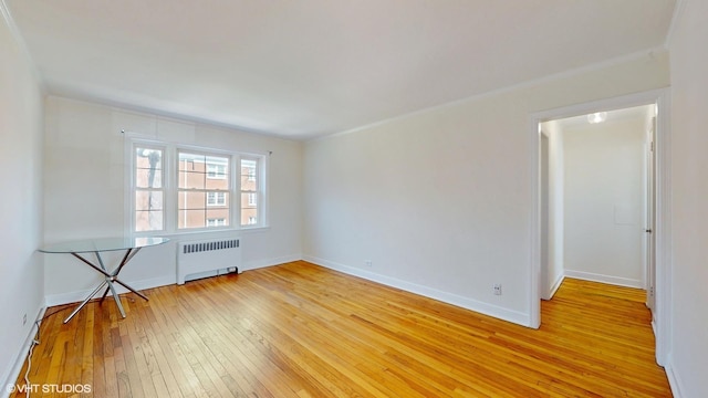 502 Bonnie Brae Pl Unit C2, River Forest, IL 60305 - unfurnished room featuring baseboards, radiator heating unit, and light wood-type flooring