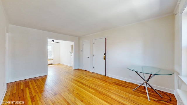 502 Bonnie Brae Pl Unit C2, River Forest, IL 60305 - unfurnished room with crown molding, radiator, baseboards, and light wood-type flooring
