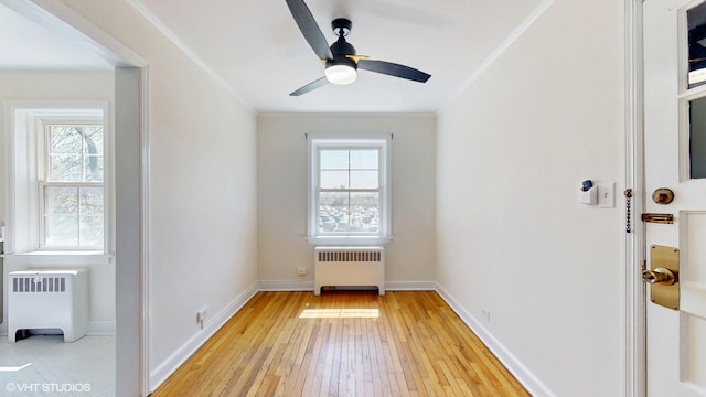 502 Bonnie Brae Pl Unit C2, River Forest, IL 60305 - interior space featuring radiator heating unit, crown molding, light wood-style floors, and a ceiling fan