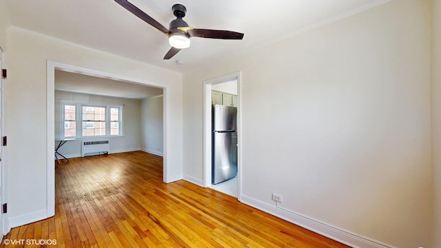 502 Bonnie Brae Pl Unit C2, River Forest, IL 60305 - unfurnished room with ceiling fan, light wood-type flooring, baseboards, radiator heating unit, and ornamental molding