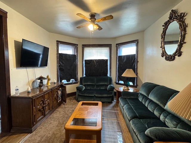 living room featuring a ceiling fan