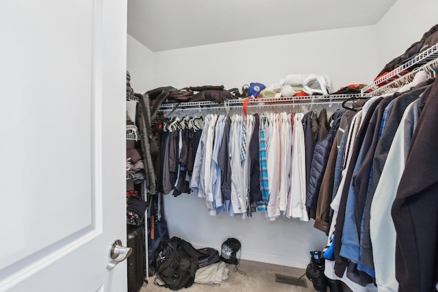 spacious closet with visible vents and carpet floors