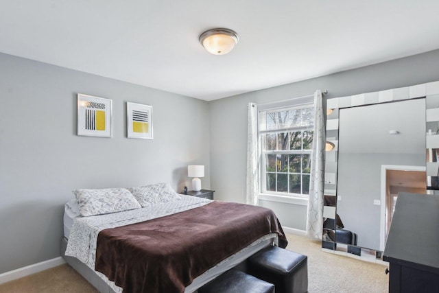 bedroom with carpet and baseboards