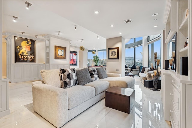 living area with visible vents and recessed lighting