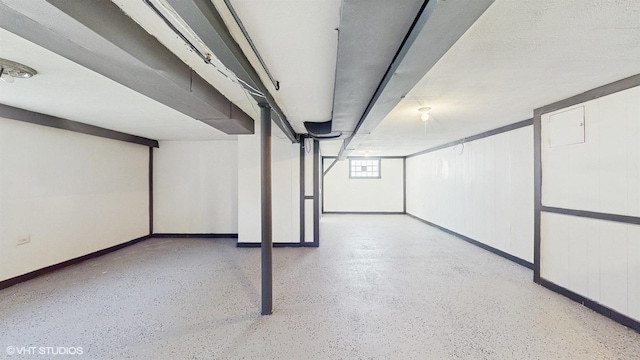 below grade area featuring baseboards