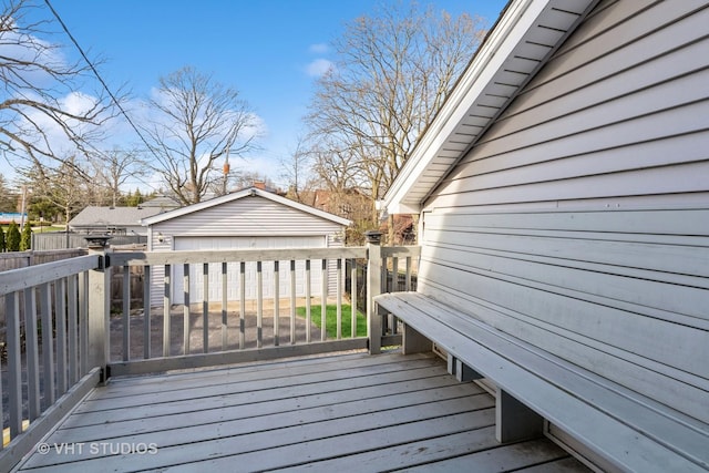 wooden terrace with fence and an outdoor structure