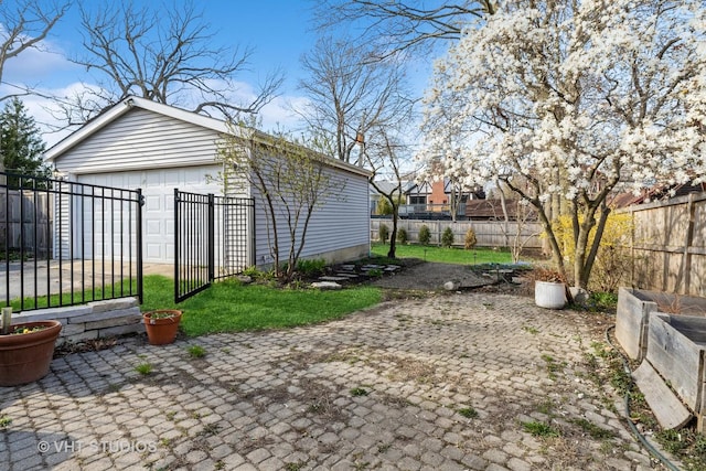 exterior space featuring a fenced backyard and an outdoor structure