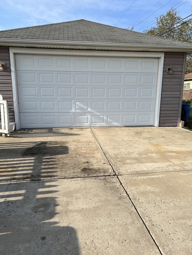 garage with concrete driveway