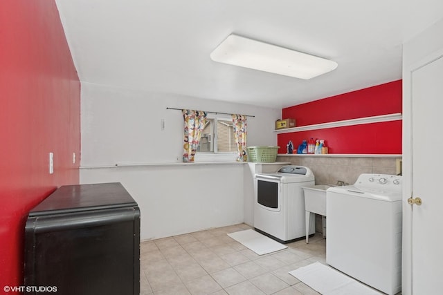 laundry area featuring independent washer and dryer and laundry area