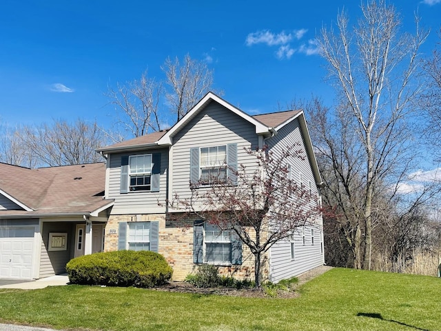view of front of house with a front yard and a garage
