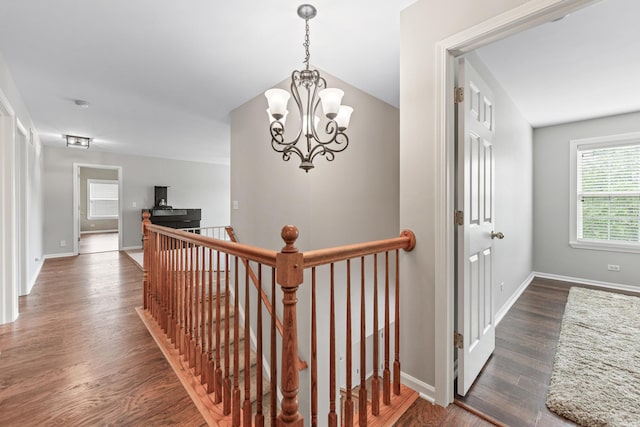 2571 Rourke Dr, Aurora, IL 60503 - hall featuring an upstairs landing, wood finished floors, a chandelier, and baseboards