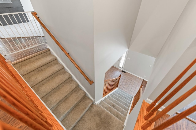 2571 Rourke Dr, Aurora, IL 60503 - staircase featuring baseboards and carpet flooring