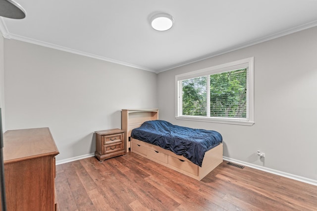 2571 Rourke Dr, Aurora, IL 60503 - bedroom with crown molding, wood finished floors, and baseboards