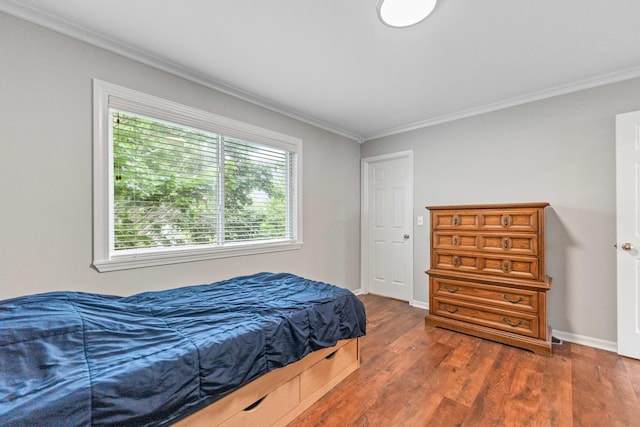2571 Rourke Dr, Aurora, IL 60503 - bedroom with crown molding, dark wood-type flooring, and baseboards