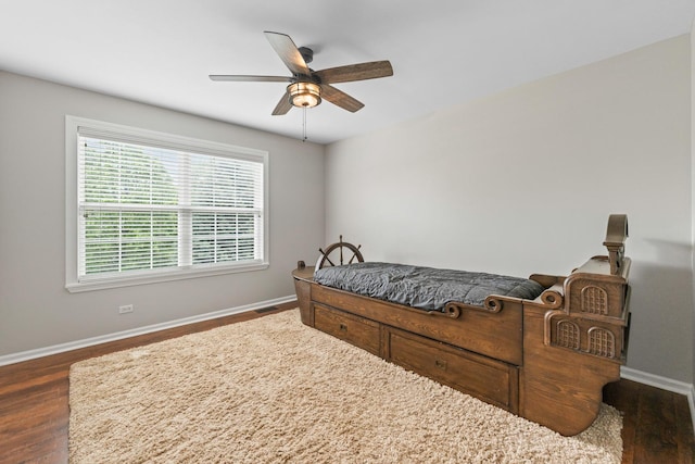 2571 Rourke Dr, Aurora, IL 60503 - bedroom featuring baseboards, multiple windows, and dark wood finished floors