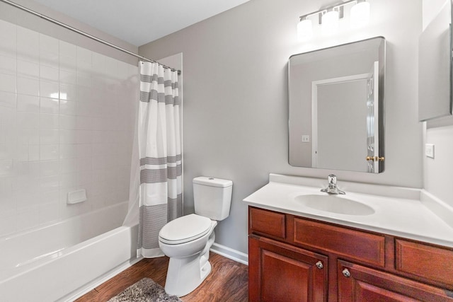 2571 Rourke Dr, Aurora, IL 60503 - bathroom featuring wood finished floors, toilet, vanity, shower / bath combo with shower curtain, and baseboards