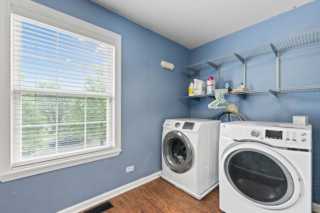 2571 Rourke Dr, Aurora, IL 60503 - laundry room with washing machine and clothes dryer, dark wood-type flooring, and baseboards