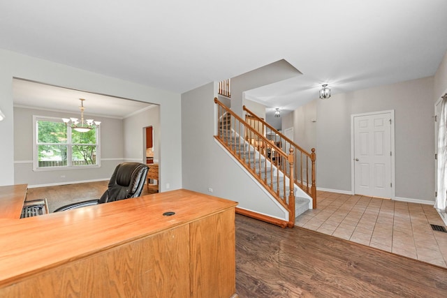 2571 Rourke Dr, Aurora, IL 60503 - home office featuring baseboards, a chandelier, wood finished floors, and crown molding