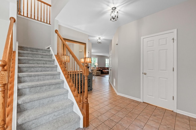 2571 Rourke Dr, Aurora, IL 60503 - stairway with baseboards and tile patterned floors