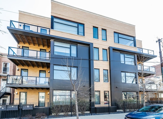 view of building exterior with fence