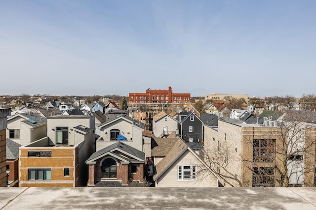 exterior space featuring brick siding and a residential view