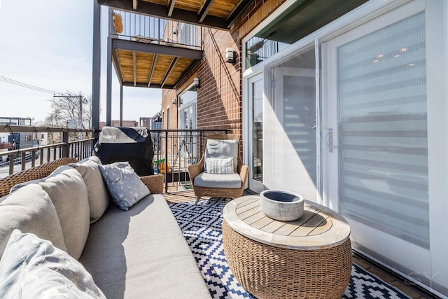 balcony with outdoor lounge area and area for grilling