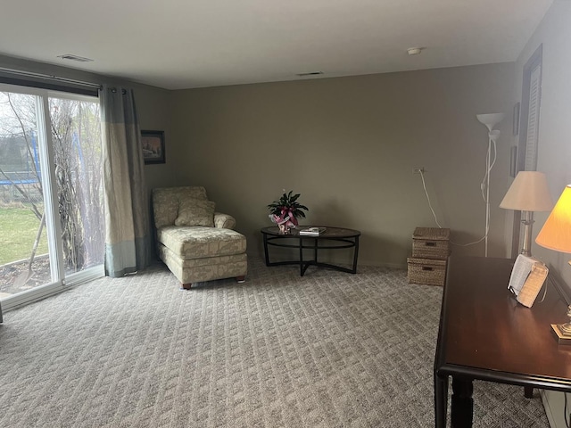 sitting room featuring carpet flooring and visible vents