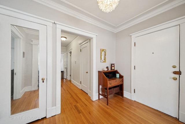 5141 S Greenwood Ave Unit 1, Chicago, IL 60615 - entryway with an inviting chandelier, ornamental molding, baseboards, and light wood-type flooring