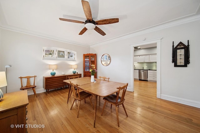 5141 S Greenwood Ave Unit 1, Chicago, IL 60615 - dining area with baseboards, light wood-style flooring, ceiling fan, and ornamental molding