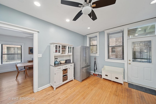 5141 S Greenwood Ave Unit 1, Chicago, IL 60615 - kitchen featuring white cabinets, high end fridge, a ceiling fan, and light wood finished floors