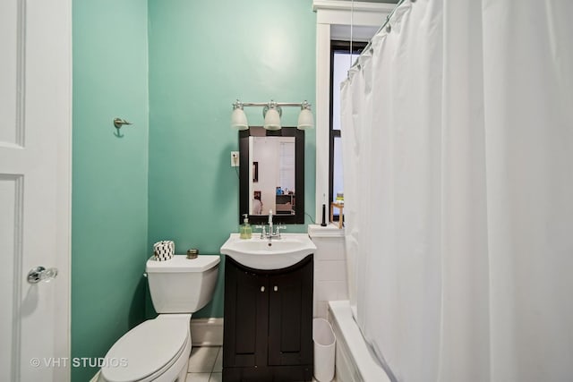 5141 S Greenwood Ave Unit 1, Chicago, IL 60615 - bathroom featuring tile patterned floors, toilet, and vanity