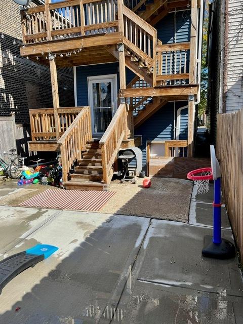 view of exterior entry featuring fence