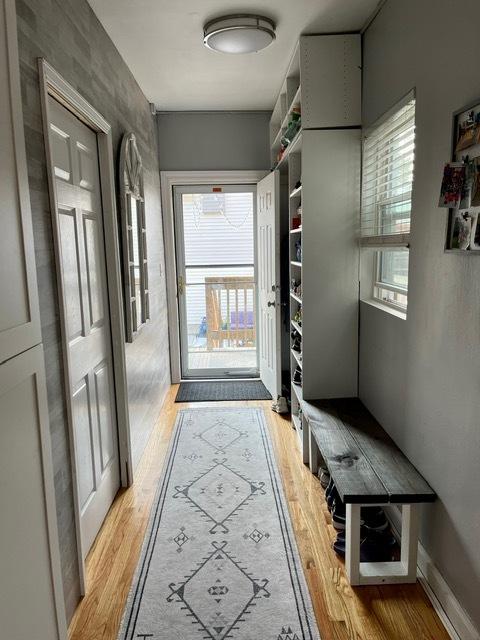 mudroom with light wood-style flooring