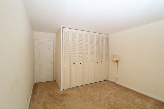 945 E Kenilworth Ave Unit 429, Palatine, IL 60074 - unfurnished bedroom featuring carpet flooring, a closet, and baseboards