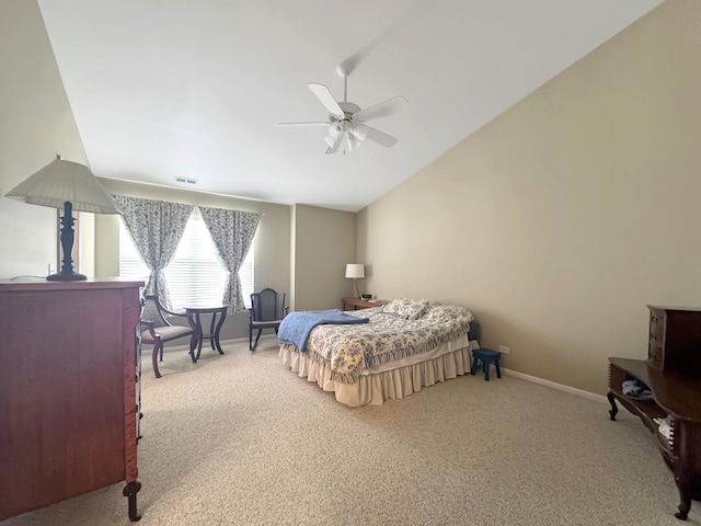 bedroom with carpet flooring, a ceiling fan, baseboards, and lofted ceiling
