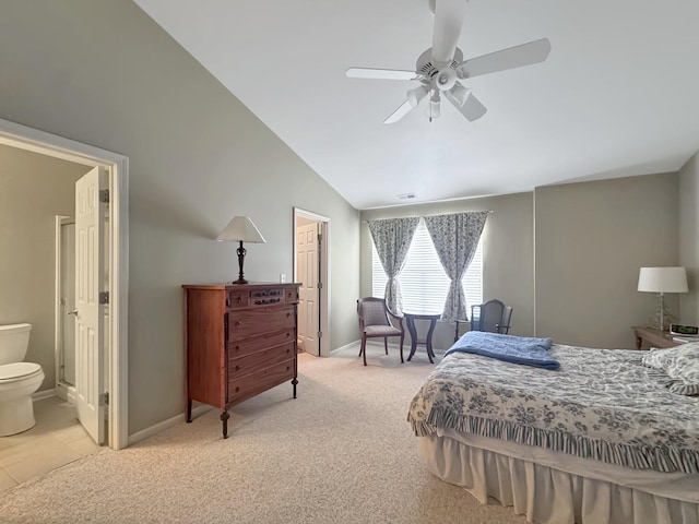 bedroom with lofted ceiling, ensuite bathroom, baseboards, light colored carpet, and visible vents