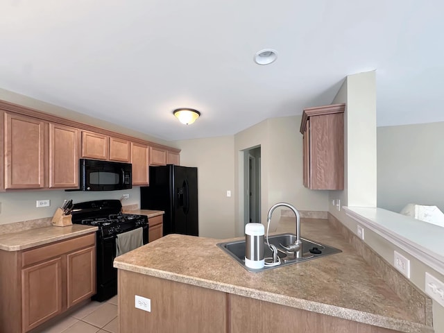 kitchen featuring light tile patterned flooring, light countertops, a peninsula, a sink, and black appliances