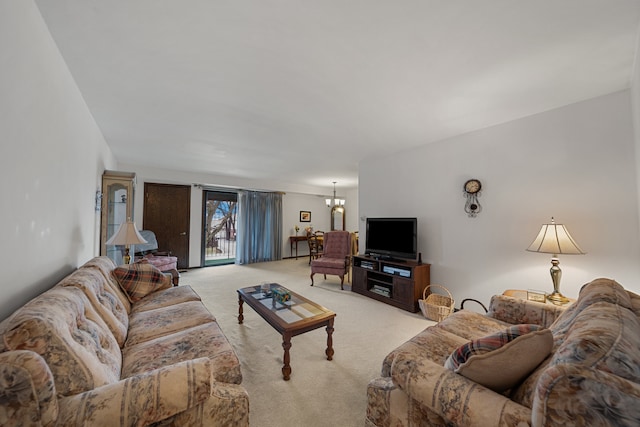 living room with a notable chandelier and light colored carpet