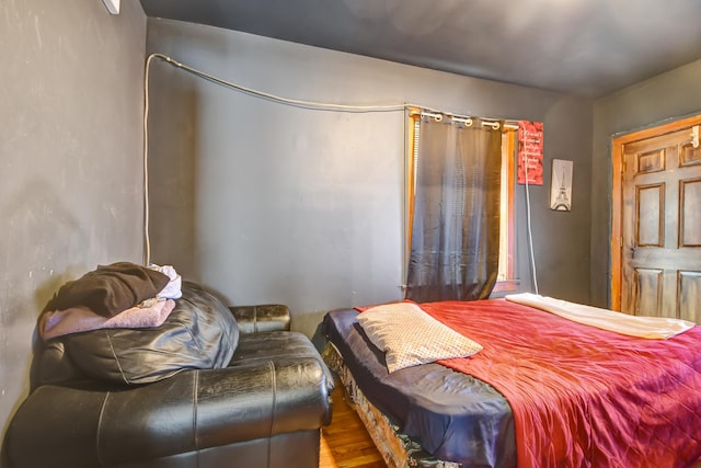 bedroom with wood finished floors