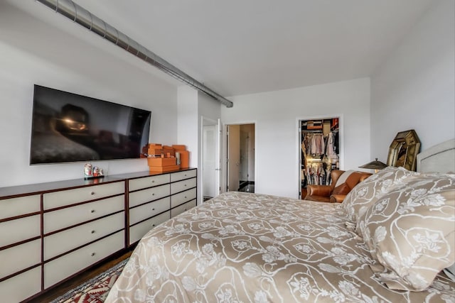 bedroom featuring a closet and a spacious closet