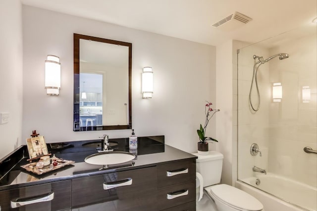 bathroom with shower / bathing tub combination, visible vents, toilet, and vanity