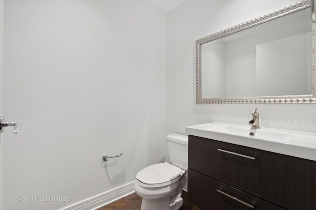 600 N Lake Shore Dr Unit 2110, Chicago, IL 60611 - bathroom featuring toilet, baseboards, and vanity