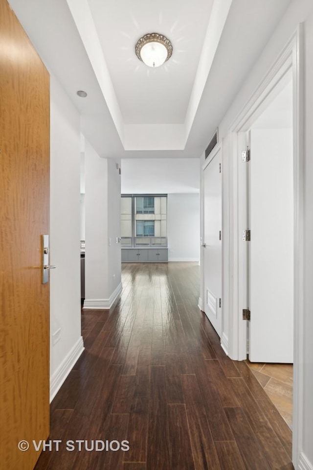 600 N Lake Shore Dr Unit 2110, Chicago, IL 60611 - hallway featuring a raised ceiling, hardwood / wood-style floors, and baseboards