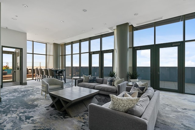 600 N Lake Shore Dr Unit 2110, Chicago, IL 60611 - living room featuring expansive windows, a towering ceiling, and carpet floors
