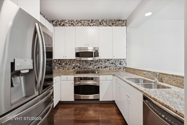600 N Lake Shore Dr Unit 2110, Chicago, IL 60611 - kitchen featuring appliances with stainless steel finishes, a sink, light stone counters, white cabinets, and tasteful backsplash
