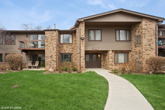 view of building exterior featuring concrete driveway and a garage