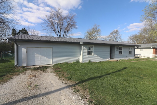 view of front of house featuring metal roof, a front yard, fence, and dirt driveway
