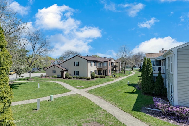 surrounding community with a lawn